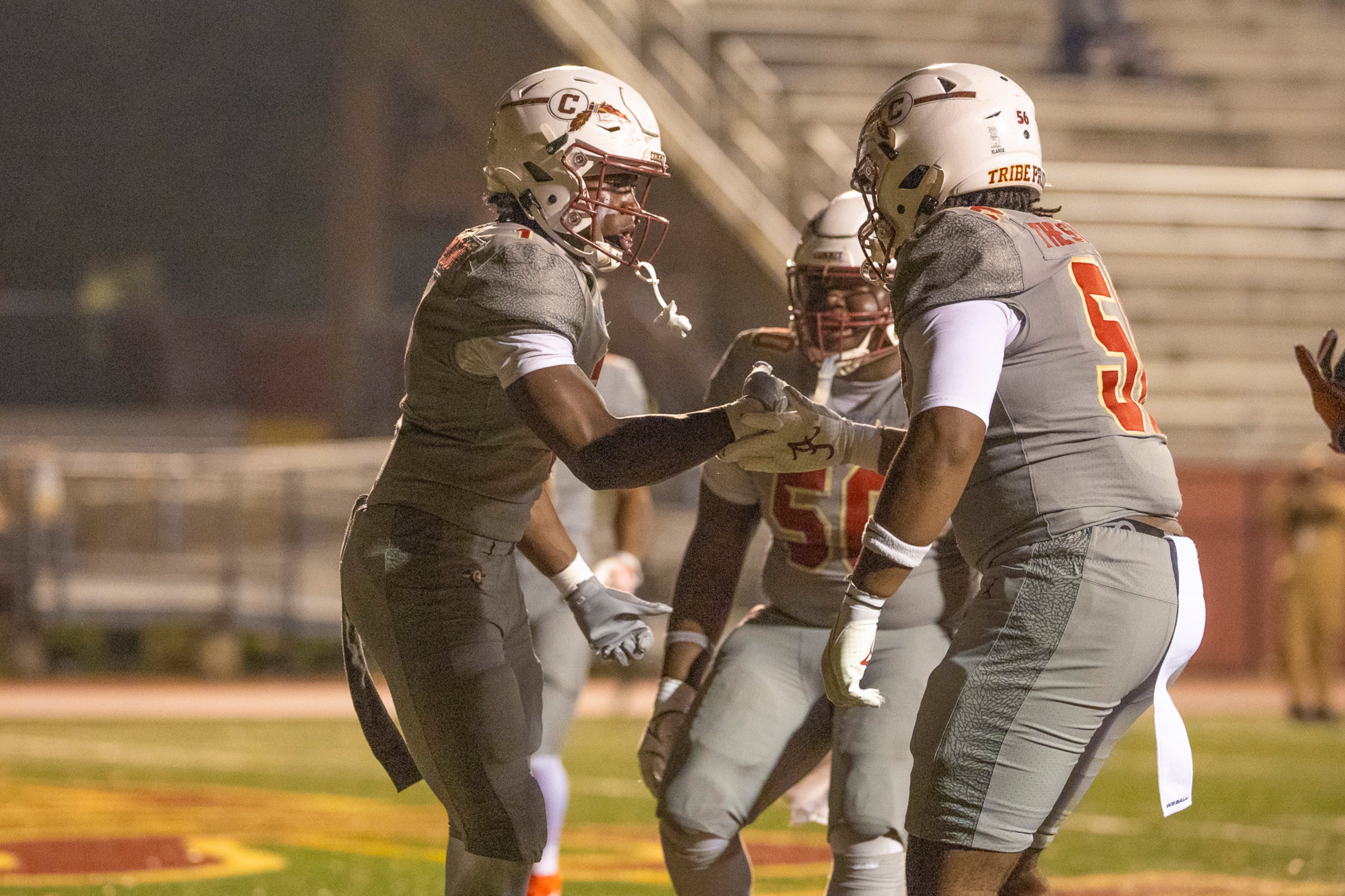 Creekside runing back Gary Walker (1) celebrates the game-winning touchdown with teammate Jamar Milfort during the second half of the class 4A semifinal against Kell at Creekside High School in Fairburn, GA on Friday, December 5, 2025. (Oscar Guevara Saenz for the AJC)