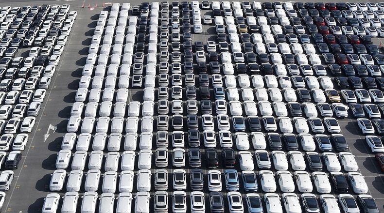 FILE - Aerial view of new cars waiting for shipment at a port in Shanghai, China, on Jan. 14, 2026. (Chinatopix via AP, File)