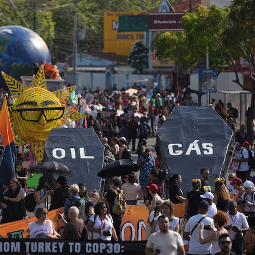 Climate activists protest with coffins that read coal, oil and gas during the COP30 U.N. Climate Summit, Saturday, Nov. 15, 2025, in Belem, Brazil. (AP Photo/Andre Penner)