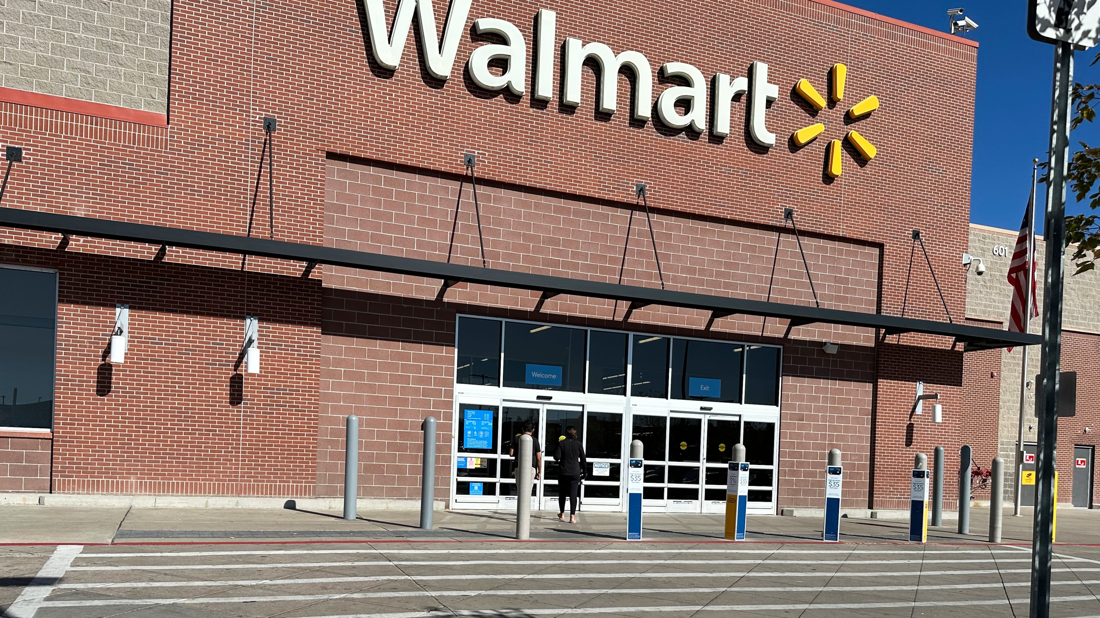 FILE - A shopper heads into a Walmart store Thursday, Oct. 16, 2025, in Englewood, Colo. (AP Photo/David Zalubowski, File)