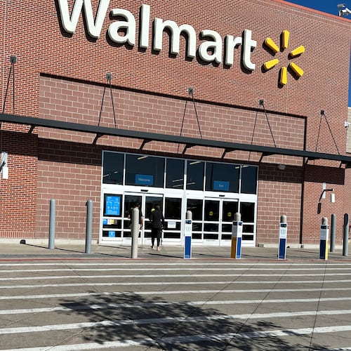 FILE - A shopper heads into a Walmart store Thursday, Oct. 16, 2025, in Englewood, Colo. (AP Photo/David Zalubowski, File)