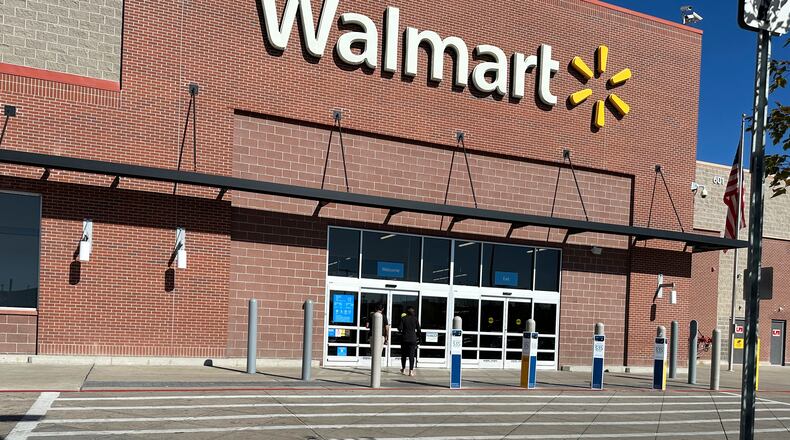 FILE - A shopper heads into a Walmart store Thursday, Oct. 16, 2025, in Englewood, Colo. (AP Photo/David Zalubowski, File)