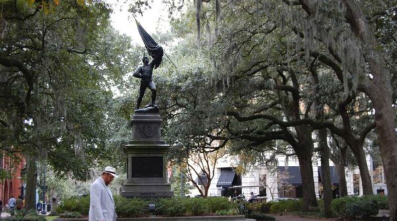 Dan Leger, aka “Savannah Dan,” sports a crisp seersucker suit and a bowtie as he leads a walking tour through Savannah.