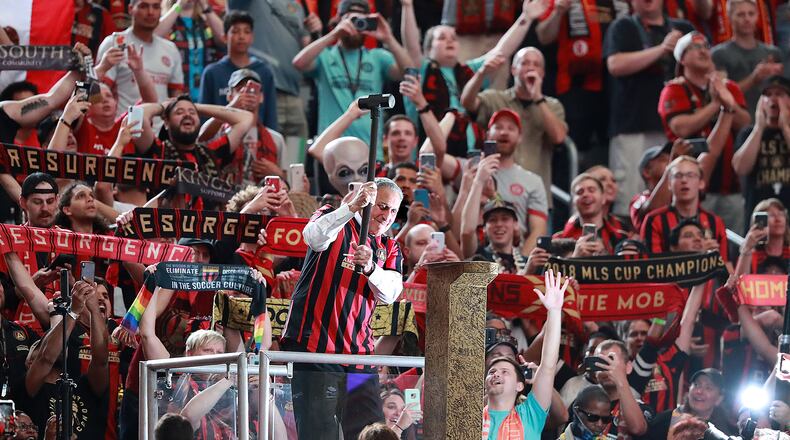 The fans cheer Atlanta United owner Arthur Blank as he hammers the golden spike to begin the game against Orlando City in a MLS soccer match on Sunday, May 12, 2019, in Atlanta. Blank also owns the Atlanta Falcons. Curtis Compton/ccompton@ajc.com