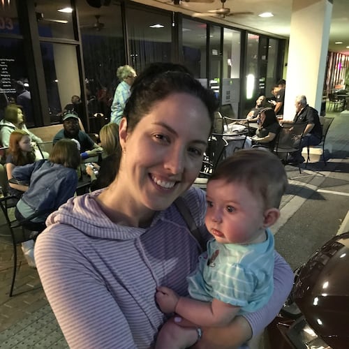 This image provided by Chris Carberg shows Jenna Carberg holding Elsie on April 30, 2017, in Winter Park, Fla. (Chris Carberg via AP)