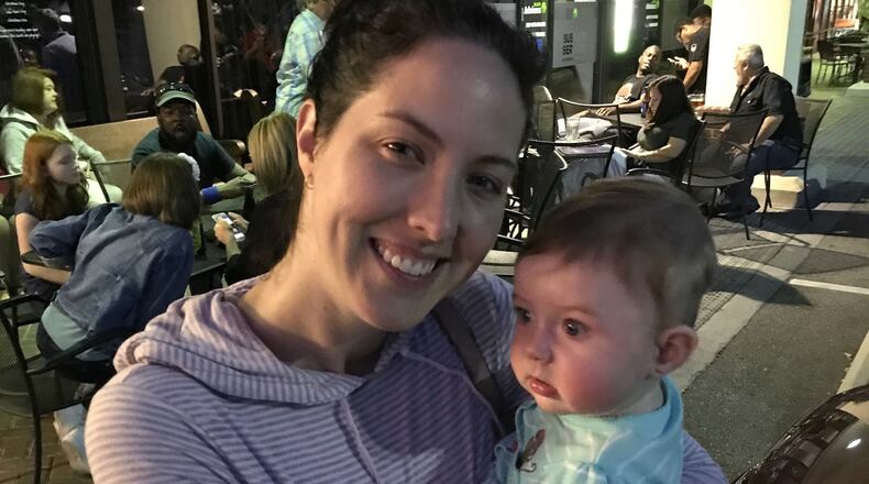 This image provided by Chris Carberg shows Jenna Carberg holding Elsie on April 30, 2017, in Winter Park, Fla. (Chris Carberg via AP)