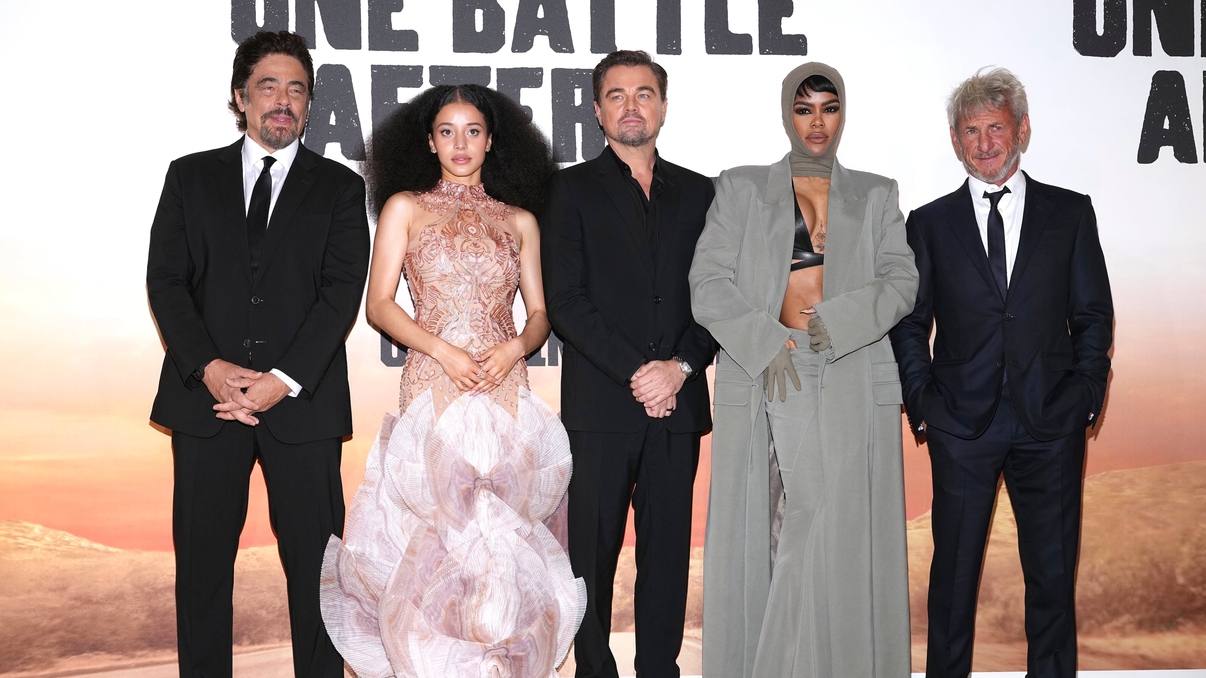 Benicio Del Toro, from left, Chase Infiniti, Leonardo DiCaprio, Teyana Taylor and Sean Penn pose for photographers upon arrival at the premiere of the film 'One Battle After Another' on Tuesday, Sept. 16, 2025, in London. (Photo by Scott A Garfitt/Invision/AP)