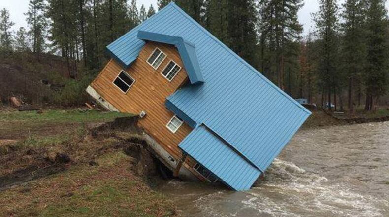 The Ferry County Sheriff’s Office posted the photo of the house that slipped this week into the Sanpoli River, a tributary of the Columbia River.
