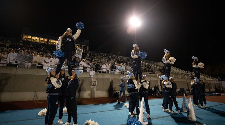 Cambridge cheerleaders cheer during a GHSA high school football game between Cambridge and South Paulding at Cambridge High School in Milton, GA., on Saturday, November 13, 2021. (Photo/Jenn Finch)