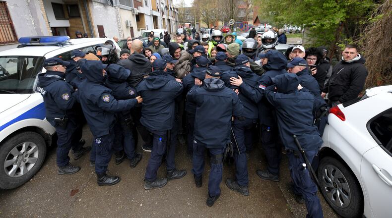 People clash with Serbian police officers during a local election, in Crvenka, small town located in the municipality of Kula, Serbia, Sunday, March 29, 2026. (AP Photo)