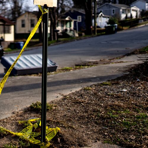 Crime scene tape remained on Tiger Flowers Drive in northwest Atlanta a day after 7-year-old Zoey Price was shot dead the night of Feb. 24, 2026. (Ben Hendren for the AJC)