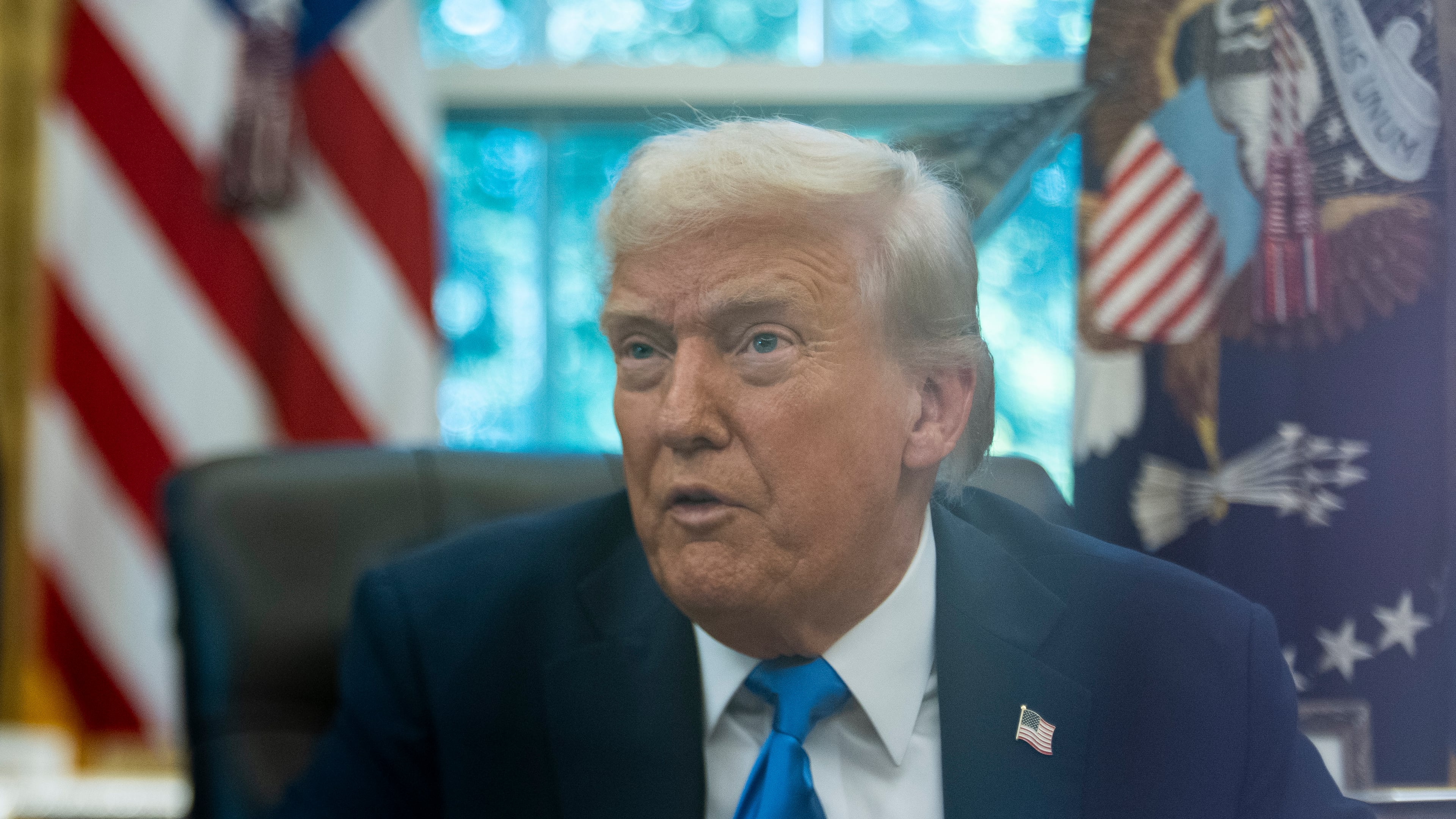 President Donald Trump speaks with reporters in the Oval Office of the White House, Friday, Sept. 19, 2025, in Washington. (AP Photo/Alex Brandon)
