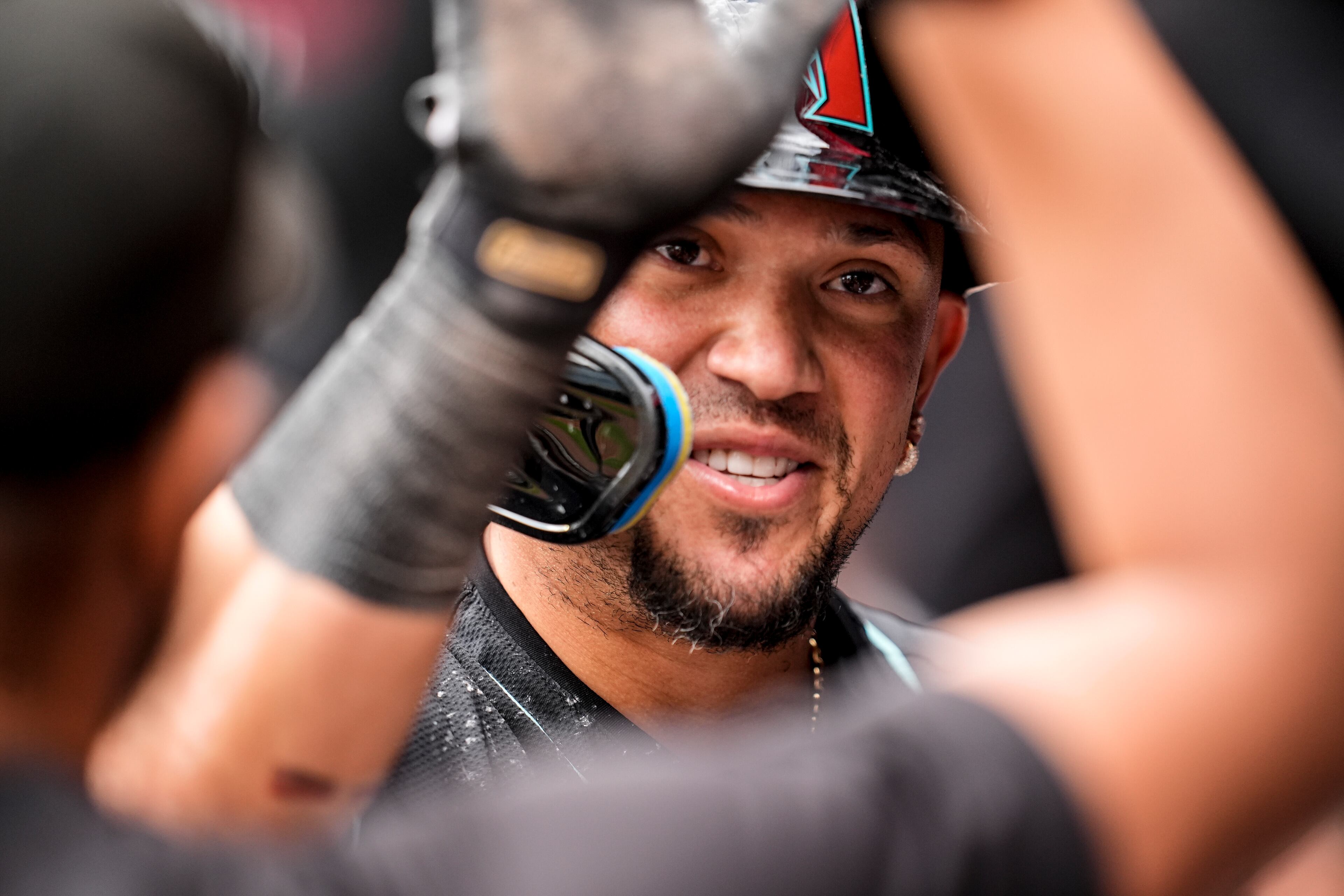 Arizona Diamondbacks second baseman Ildemaro Vargas (6) celebrates scoring in the ninth inning of a baseball game against the Atlanta Braves, Thursday, June 5, 2025, in Atlanta. (AP Photo/Mike Stewart)