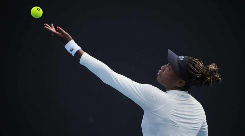 Venus Williams of the United States serves during a practice session ahead of the Australian Open tennis championship in Melbourne, Australia, Friday, Jan. 16, 2026. (AP Photo/Dita Alangkara)