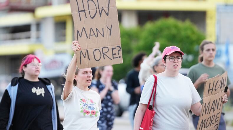 Protesters march after a Madison police officer shot and killed a man Wednesday, July 22, 2026, in Madison, Wis. (AP Photo/Kayla Wolf)