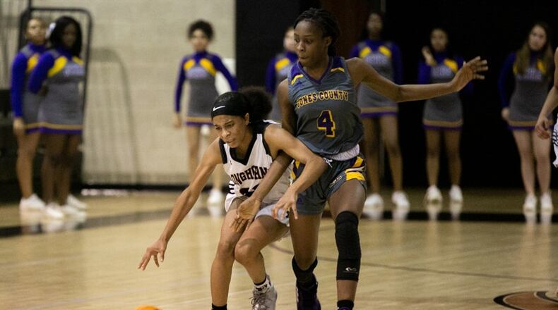 Kell High School's Crystal Henderson (right) reaches for the ball with against Jones County's Sikoya Hogan (4) in the 2020 state playoffs.