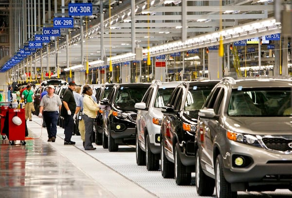 A line of 2011 Kia Sorento vehicles travel along the assembly line in a Kia automobile manufacturing facility in West Point. (Courtesy of Kia)
