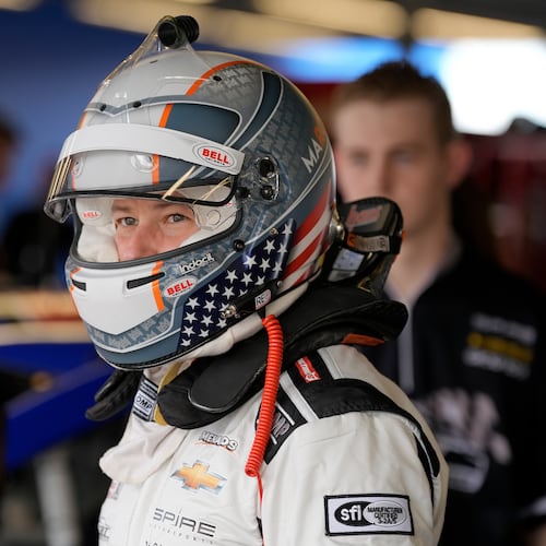 FILE - ARCA driver Marco Andretti looks out of the garage before a practice run for an ARCA Mendards Series auto race Thursday, Feb. 15, 2024, at Daytona International Speedway in Daytona Beach, Fla. (AP Photo/Chris O'Meara, file)