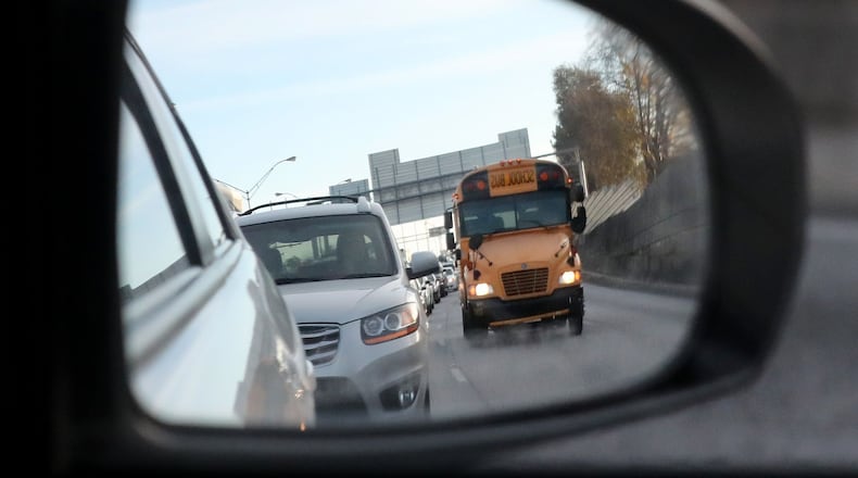 December 15, 2016, ATLANTA: A school bus navigates rush hour traffic on I-75 South on Thursday, Dec. 15, 2016, in Atlanta.     Curtis Compton/ccompton@ajc.com