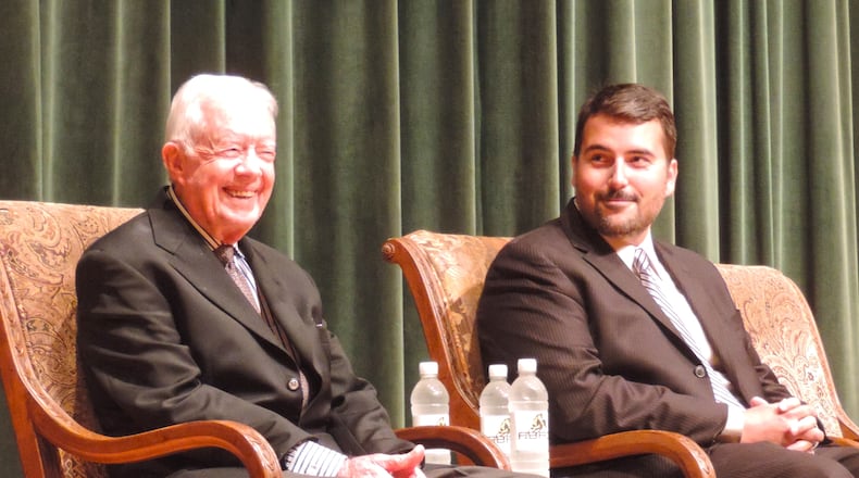 Former President Jimmy Carter, left, smiles during a 2014 visit to Abraham Baldwin Agricultural College. Pictured to his right is Joseph F. Brown, then an associate English professor at the college. Contributed photo.