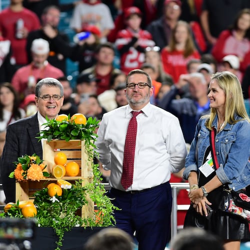 (From left): Jere Morehead, Josh Brooks, Mary Beth Smart and Kirby Smart take part in the trophy presentation following the 90th Orange Bowl game between Georgia and Florida State at Hard Rock Stadium inn Miami Gardens, Florida. (Perry McIntyre/UGA Sports Communications 2023)