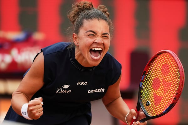 Jasmine Paolini of Italy, reacts after defeating Coco Gauff of the United States during their final tennis match in the Italian Open at the Foro Italico in Rome, Saturday, May 17, 2025. (AP Photo/Alessandra Tarantino)
