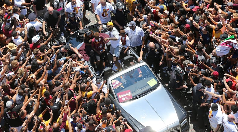 Cleveland Cavaliers forward LeBron James dances along with fans during a parade in downtown Cleveland for the NBA basketball champions, Wednesday, June 22, 2016. (Joshua Gunter/Cleveland.com via AP)