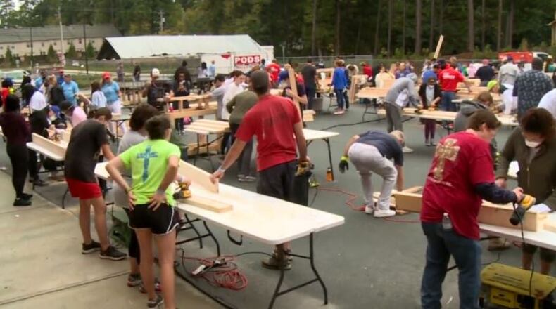 Students and staff at Baggett Elementary School and Lilburn Elementary School in Gwinnett teamed up with Lowes and Sleep in Heavenly Peace recently to build bunk beds for local families and hurricane victims. COURTESY OF GWINNETT COUNTY PUBLIC SCHOOLS