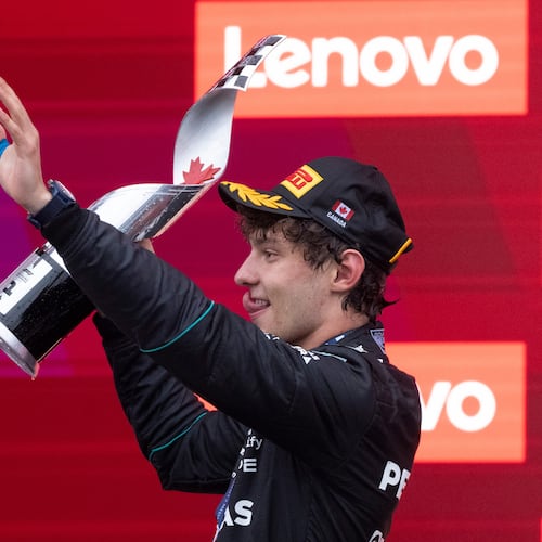 Mercedes driver Kimi Antonelli, of Italy, waves as he holds his trophy following his win in the F1 Canadian Grand Prix auto race in Montreal, Sunday, May 24, 2026. (Christinne Muschi/The Canadian Press via AP)