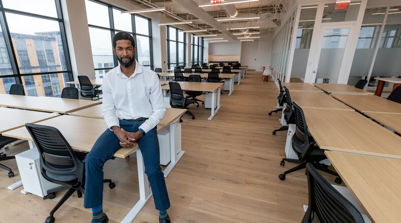 SVP Community and Assistant Manager Errol Williams poses for a photograph in one of the office spaces at the new Wework building in Atlanta Friday, Nov. 11, 2022.  (Steve Schaefer/steve.schaefer@ajc.com)