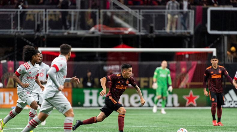 Atlanta United midfielder Ezequiel Barco #8 dribbles the ball during the match against Toronto FC at Mercedes-Benz Stadium in Atlanta, Georgia on Saturday October 30, 2021. (Photo by Dakota Williams/Atlanta United)