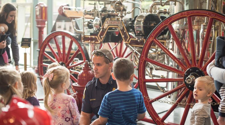 Nov. 17 is the deadline for those who may be selected to be interviewed for a Marietta Fire Department video for new firefighters — people who have been helped by Marietta EMTs. Here a Marietta firefighter guides a preschool tour of the Marietta Fire Museum, which is undergoing renovation. Courtesy of Marietta