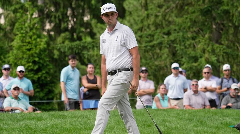 J.T. Poston reacts to his chip shot onto the sixth green during the third round of the Memorial golf tournament, in Dublin, Ohio, Saturday, June 6, 2026. (AP Photo/Sue Ogrocki)