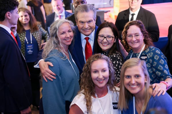 Jackson poses for a photograph with supporters at his election night party at the Omni at the Battery during the 2026 Georgia primary elections Tuesday, May 19, 2026, in Atlanta. (Jason Getz/AJC)