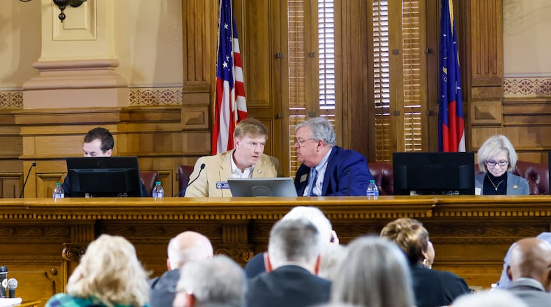 Sen. Blake Tillery, left, and Rep. Matt Hatchett — who head the General Assembly's two budget-writing committees — confer. Hatchett praised an agreement that House and Senate leaders reached Thursday, the last day of the 2024 legislative session. “We’re doing a lot of great things for this state (in the budget),” the Dublin Republican said. “The budget reflects a good picture of our state and where we are.” (Arvin Temkar / arvin.temkar@ajc.com)