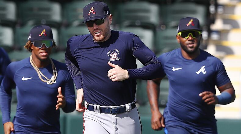 Braves Ronald Acuna (from left), Freddie Freeman and Marcell Ozuna run sprints around the bases Sunday, Feb. 16, 2020, at CoolToday Park in North Port, Fla.