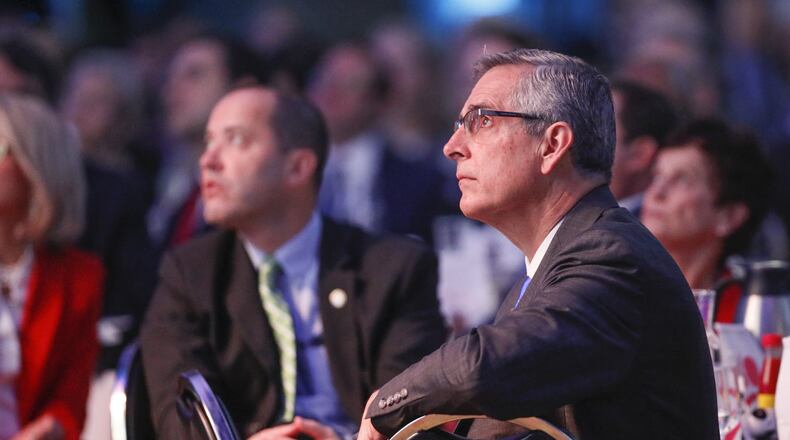 Secretary of State Brad Raffensperger listens to speakers at the annual Georgia Chamber of Commerce - Eggs & Issues Breakfast. Many networking events have been canceled and replaced with virtual events because of the coronavirus pandemic. Bob Andres / bandres@ajc.com AJC FILE PHOTO