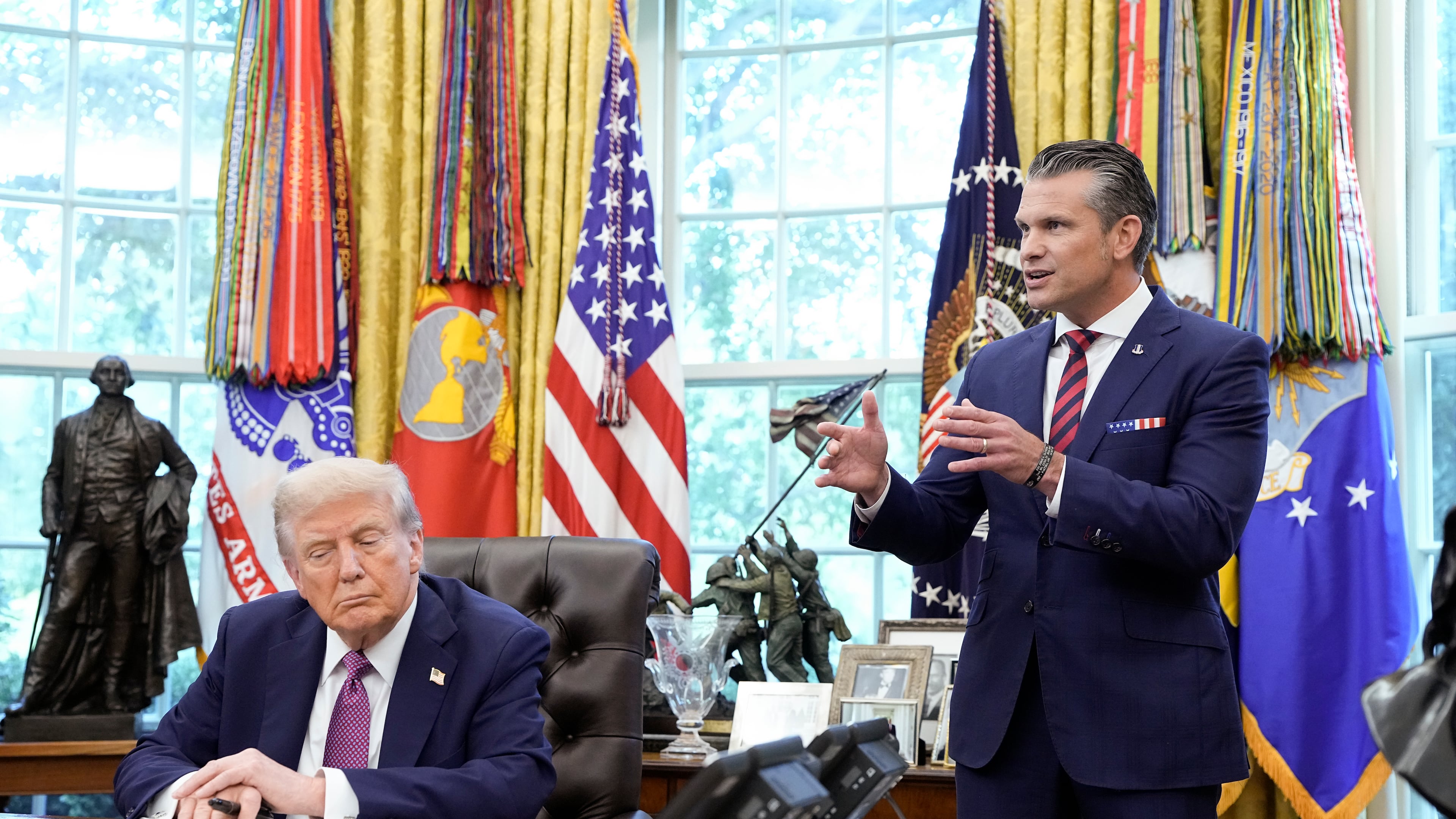 Secretary of Defense Pete Hegseth speaks alongside President Donald Trump during an event where Trump signed an executive order on renaming the Department of Defense in the Oval Office in Washington, on Friday, Sept. 5, 2025. Trump’s executive order authorizes the Department of Defense and the secretary of defense to be called the Department of War and the secretary of war. It is unclear how it will be formalized, given that Congress approved the name. (Haiyun Jiang/The New York Times)