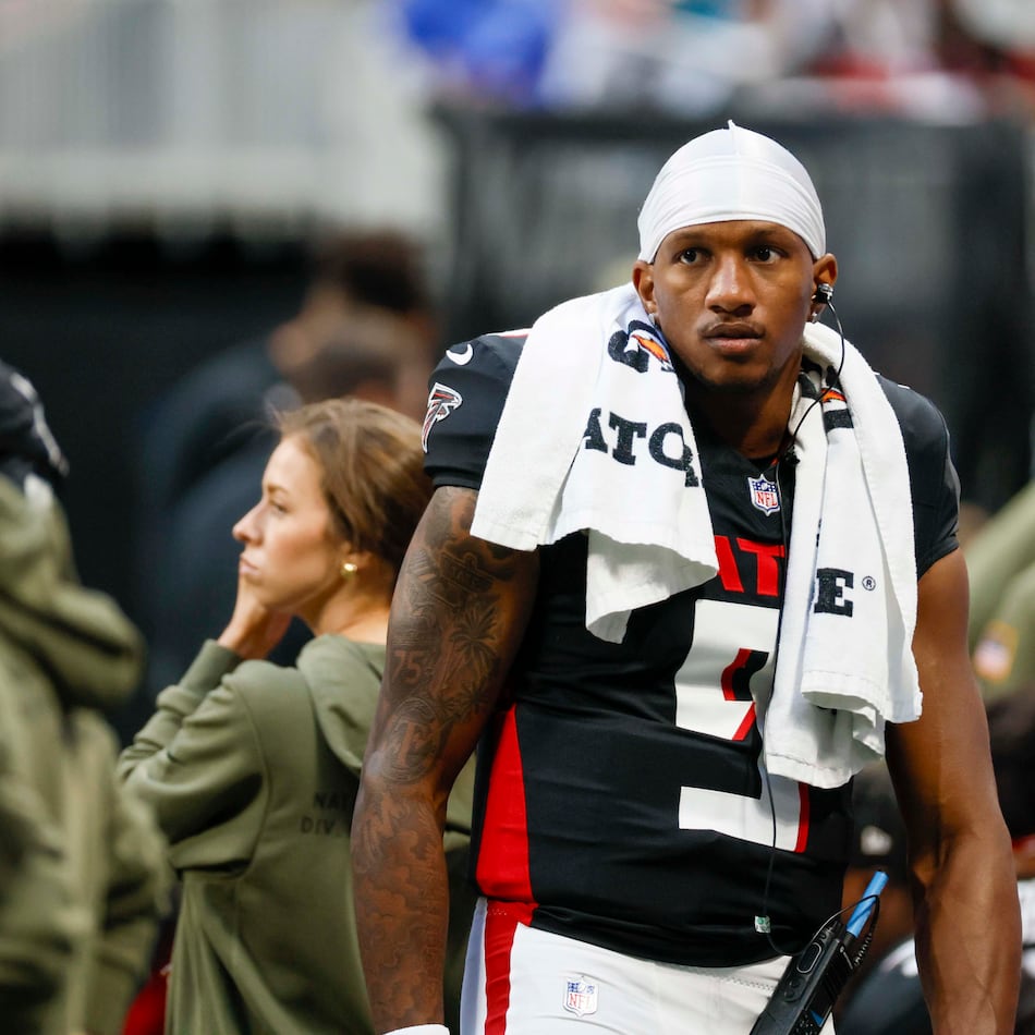 Atlanta Falcons quarterback Michael Penix Jr. is seen on the sidelines after leaving the field with an apparent injury during the second half of an NFL game against the Carolina Panthers at Mercedes-Benz Stadium in Atlanta on Sunday, Nov. 16, 2025. (Miguel Martinez/AJC)