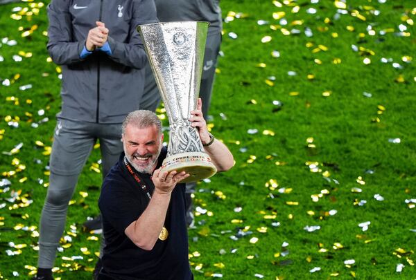 Tottenham Hotspur manager Ange Postecoglou lifts the Europa League trophy following the team's victory over Manchester United at the Estadio de San Mames, Bilbao, Spain, Wednesday, May 21, 2025. (Andrew Milligan/PA via AP)