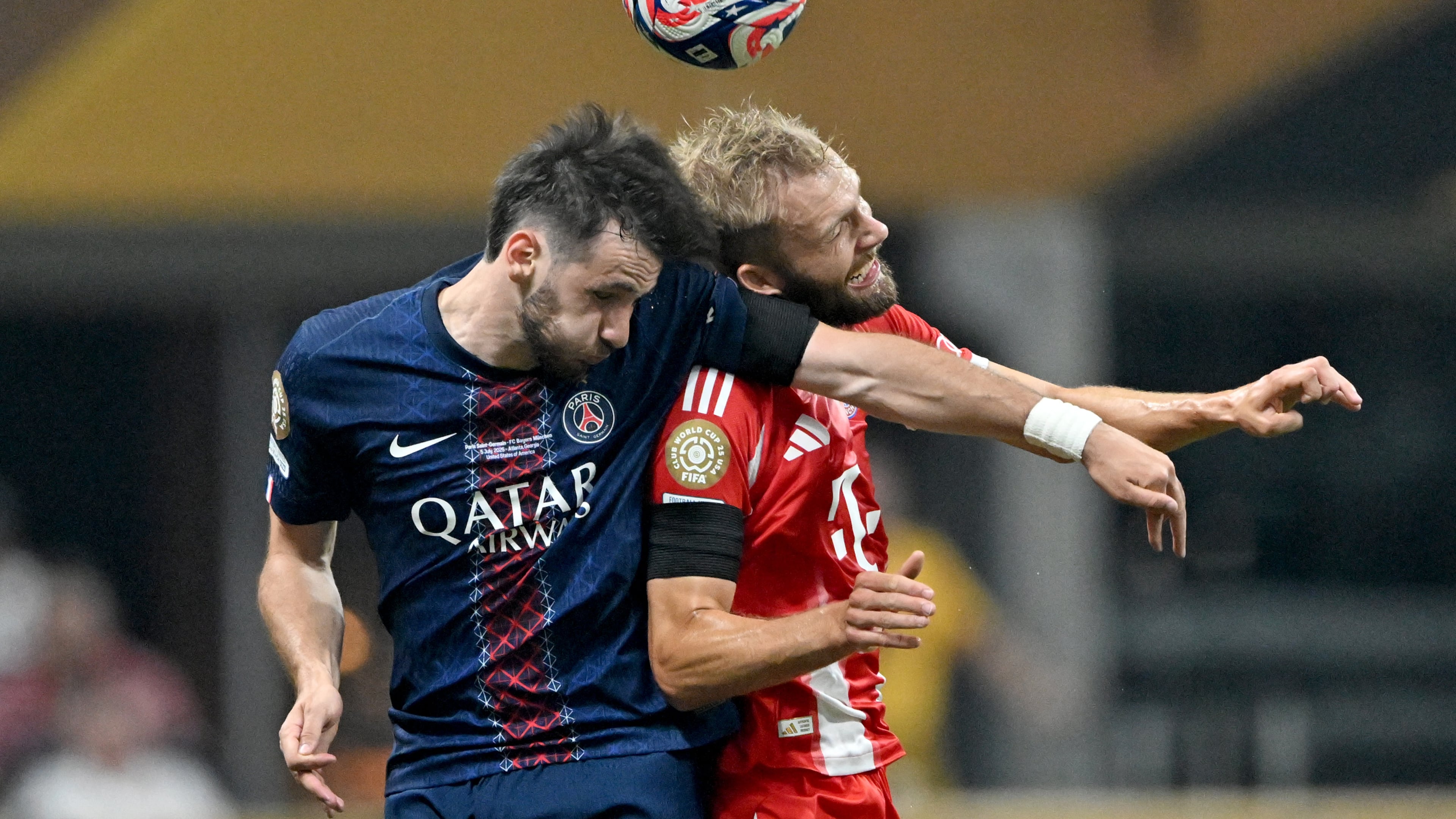 Paris Saint-Germain forward Khvicha Kvaratskhelia and Bayern Munich midfielder Konrad Laimer collide on a header during the first half in the Club World Cup quarterfinals match at Mercedes-Benz Stadium, Saturday, July 5, 2025, in Atlanta. (Hyosub Shin/AJC)