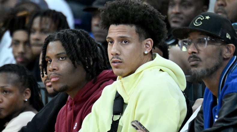 Injured Hawks star Jalen Johnson watches high school basketball last week at the Georgia State Convocation Center.(Hyosub Shin / AJC)