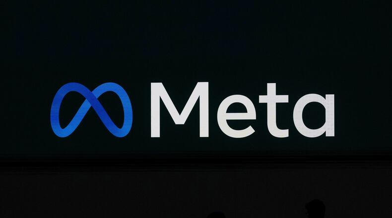 FILE - A Meta logo is shown on a video screen at LlamaCon 2025, an AI developer conference, in Menlo Park, Calif., April 29, 2025. (AP Photo/Jeff Chiu, File)
