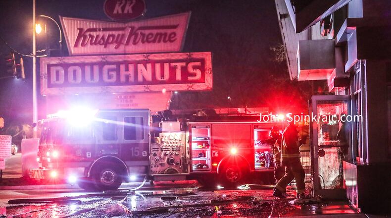 Atlanta fire crews worked to put out hot spots at the Ponce de Leon Avenue landmark late into the morning.