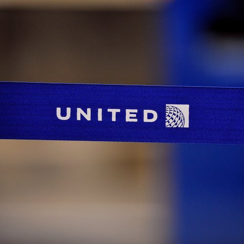 FILE - The United Airlines logo can be seen on a rope line at O'Hare International Airport, May 17, 2011. (AP Photo/Brian Kersey, File)
