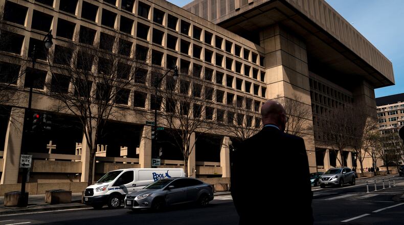 Man walks by FBI headquarters in Washington, D.C.