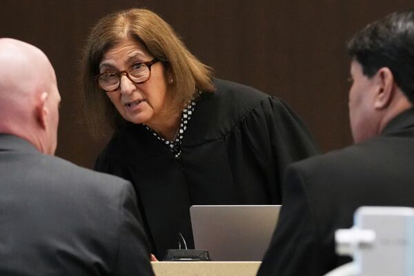 Judge Victoria A. Rossetti, center, talks with Lake County Assistant State's Attorney Ben Dillon, left, and Robert E. Crimo III's attorney Gregory Ticsay during the sentencing hearing for Robert E. Crimo III., at the Lake County Courthouse, in Waukegan, Ill., Wednesday, April 23, 2025. (AP Photo/Nam Y. Huh, Pool)