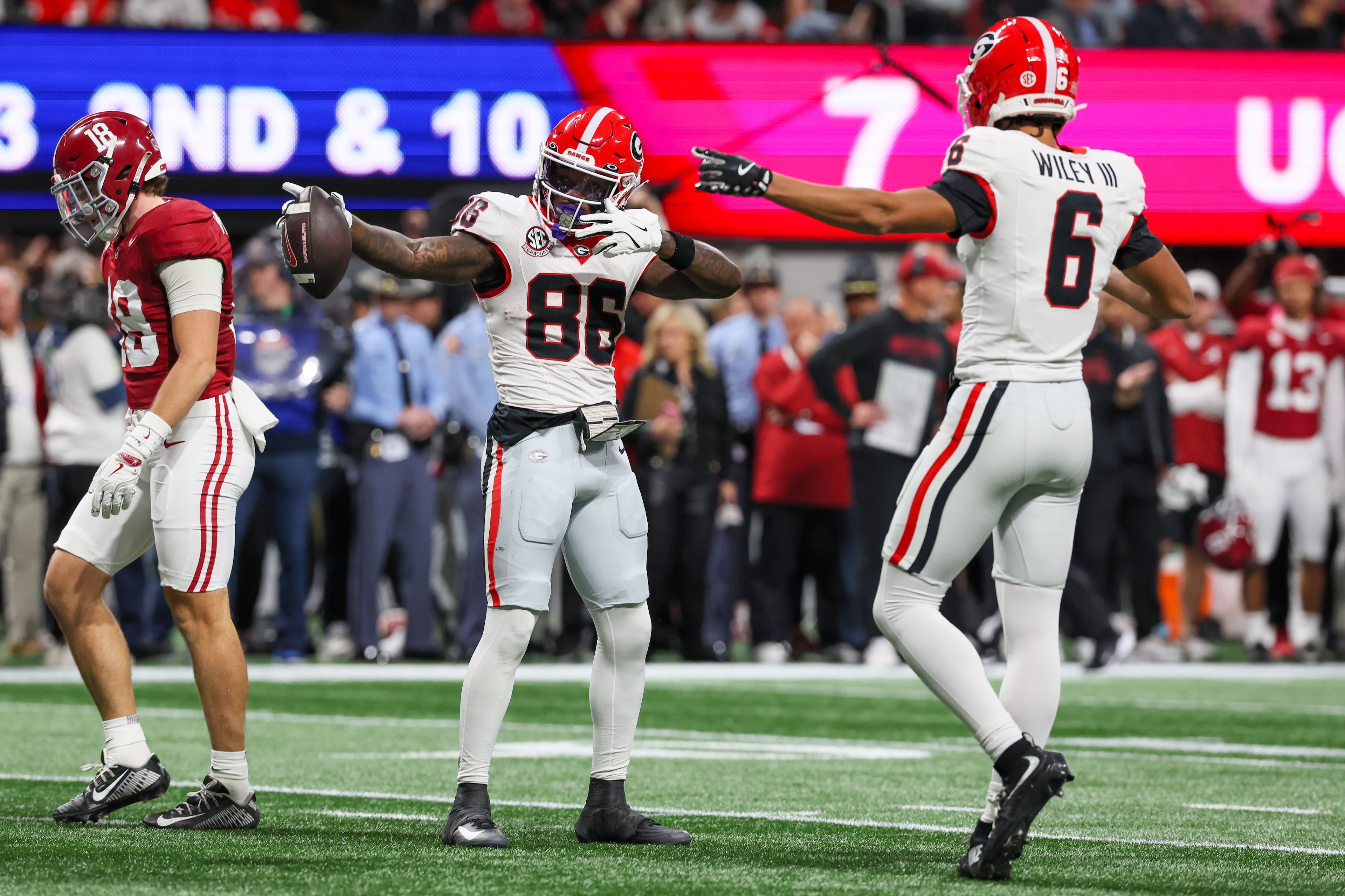 Georgia wide receiver Dillon Bell (86) celebrates a first down catch against Alabama during the first half of the SEC Championship game at Mercedes-Benz Stadium, Saturday, Dec. 6, 2025, in Atlanta. (Jason Getz / AJC)