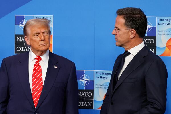 President Donald Trump is greeted by NATO Secretary General Mark Rutte, right, during an official welcome at the NATO summit in The Hague, Netherlands, Wednesday, June 25, 2025. (AP Photo/Geert Vanden Wijngaert)