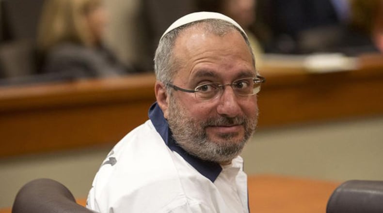 <p>Hemy Neuman surveys the courtroom during his motion for a new trial in front of DeKalb County Judge Gregory Adams at the DeKalb County Courthouse in Decatur, Tuesday, July 9, 2019. (Alyssa Pointer/alyssa.pointer@ajc.com)</p>